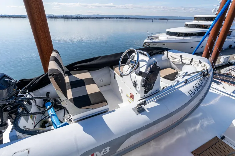 Slide: The Image of Inflatable boat on 1986 Hatteras 63 Motor Yacht, docked with scenic water view. - 92