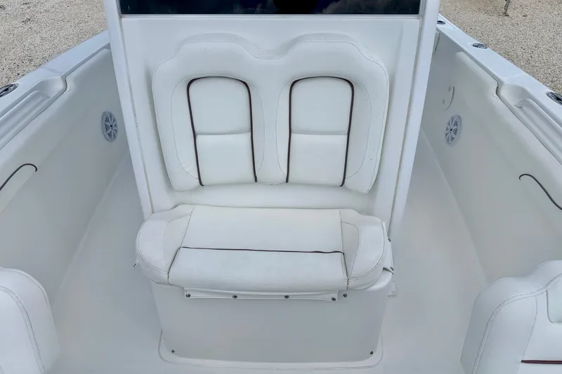 Slide: The Image of 2018 Sea Hunt Gamefish 27 boat interior with white cushioned seating. - 12