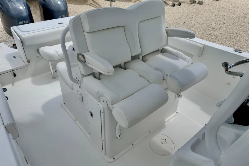 Slide: The Image of 2018 Sea Hunt Gamefish 27 boat interior with dual white captain's chairs. - 15