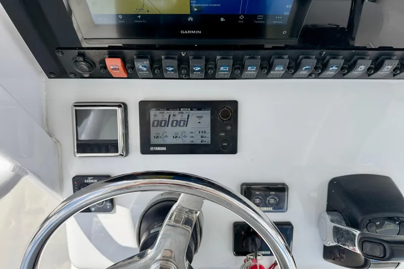 Slide: The Image of Control panel of a 2018 Sea Hunt Gamefish 27 boat with Garmin display and Yamaha controls. - 18