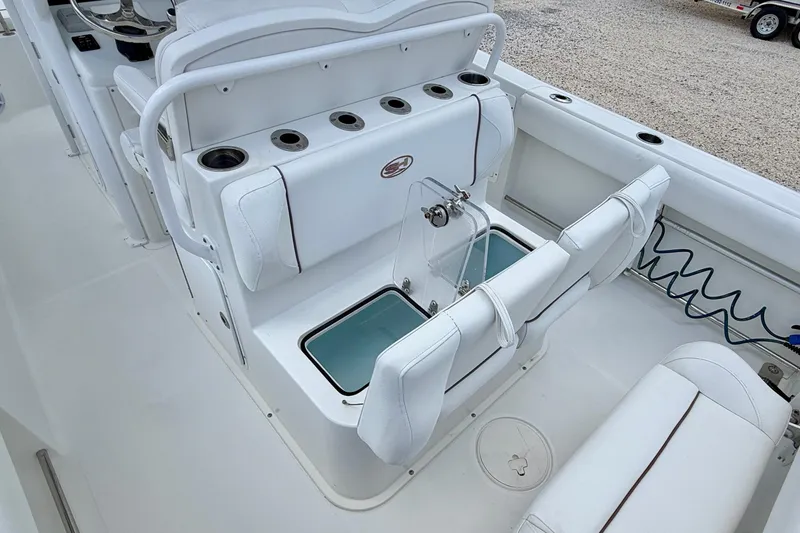Slide: The Image of 2018 Sea Hunt Gamefish 27 boat interior with seating and storage compartments. - 30