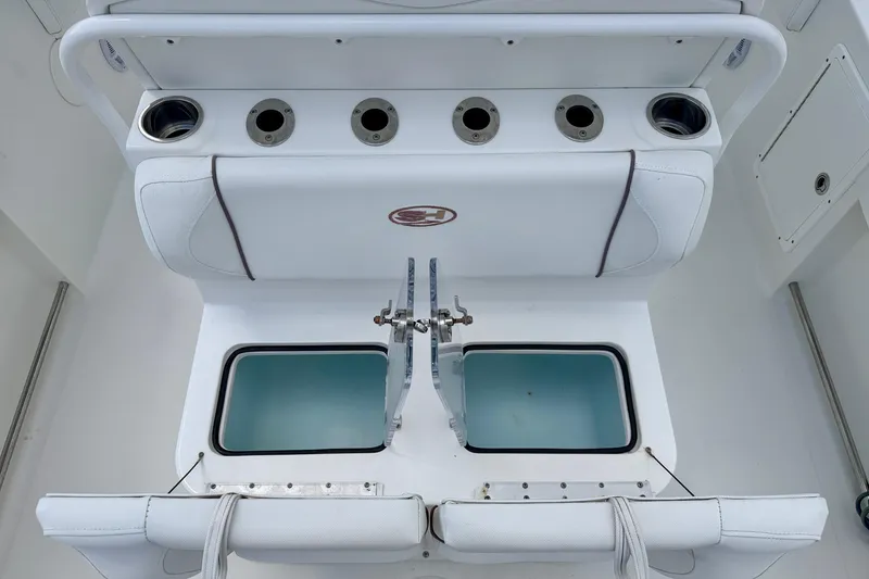 Slide: The Image of 2018 Sea Hunt Gamefish 27 boat interior with rod holders and livewell. - 31