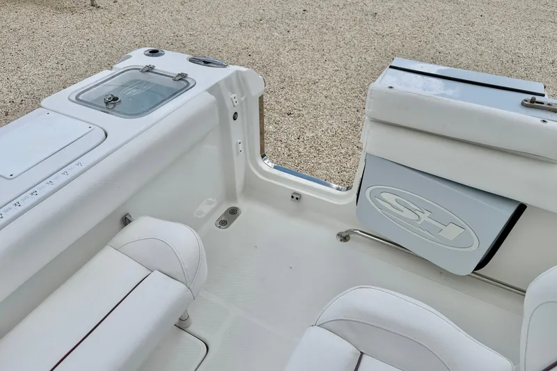 Slide: The Image of 2018 Sea Hunt Gamefish 27 boat interior with seating and storage compartments. - 33