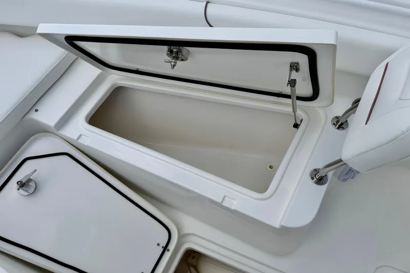 Slide: The Image of Open storage compartment on a 2018 Sea Hunt Gamefish 27 boat, showcasing interior space. - 39