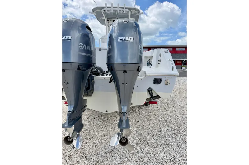 Slide: The Image of 2018 Sea Hunt Gamefish 27 with dual Yamaha 200 engines, parked on gravel. - 41
