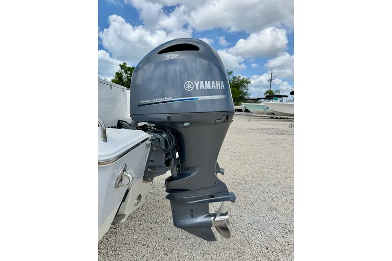 Slide: The Image of Yamaha outboard motor on 2018 Sea Hunt Gamefish 27, parked on gravel under blue sky. - 44