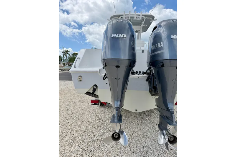 Slide: The Image of 2018 Sea Hunt Gamefish 27 with twin Yamaha 200 engines, parked on gravel. - 45