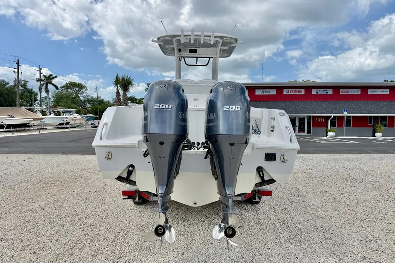 Slide: The Image of 2018 Sea Hunt Gamefish 27 with twin Yamaha 200 engines, parked outdoors. - 6