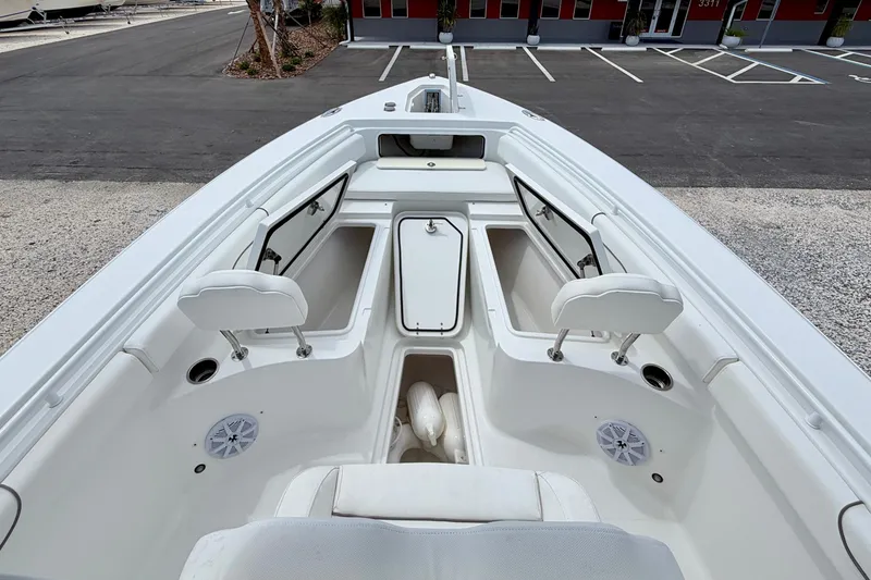 Slide: The Image of 2018 Sea Hunt Gamefish 27 boat interior with open storage compartments and seating. - 9