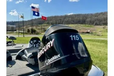 Slide: The Image of 2011 Nitro Z-6 boat with Mercury OptiMax 115 engine, flags in background. - 10