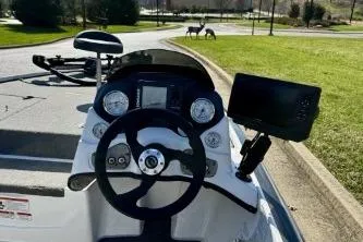 Slide: The Image of 2011 Nitro Z-6 boat dashboard with steering wheel and electronic display. - 3