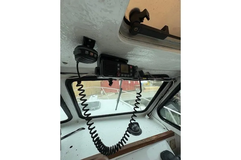 Slide: The Image of Interior of 1989 C-Hawk 29 Sport Cabin with mounted radio equipment. - 13