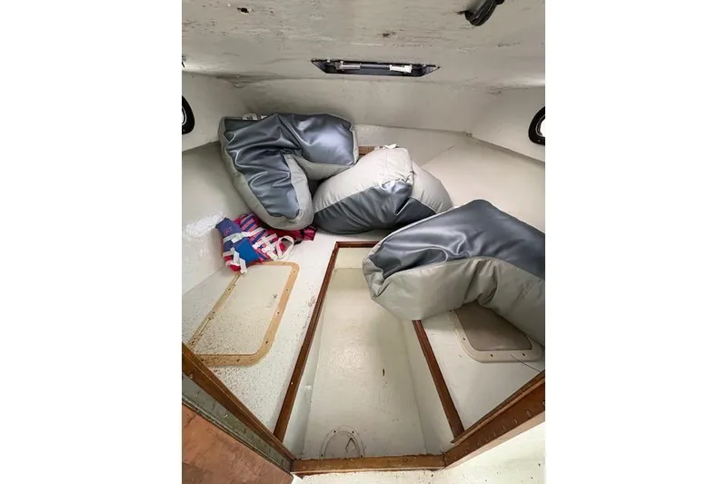 Slide: The Image of 1989 C-Hawk 29 Sport Cabin interior with cushions and storage compartments. - 7