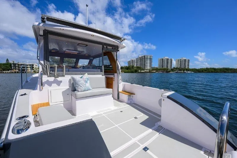 Slide: The Image of 2022 True North 34 boat on water, featuring spacious deck and modern design. - 18