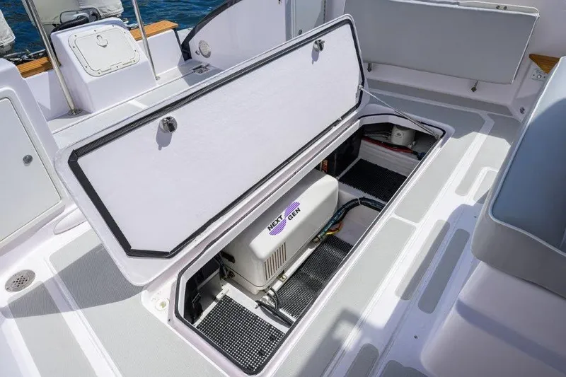 Slide: The Image of Open storage compartment on 2022 True North 34 boat, showcasing interior equipment. - 26
