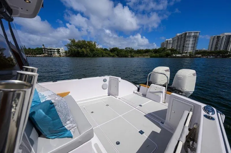 Slide: The Image of True North 34 boat deck with scenic waterfront view, 2022 model. - 29