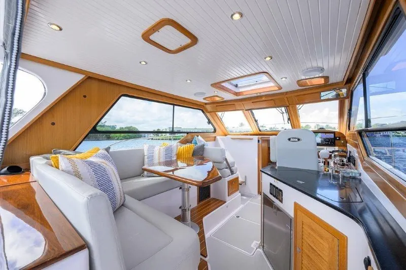 Slide: The Image of Luxurious interior of 2022 True North 34 yacht with elegant seating and panoramic windows. - 47