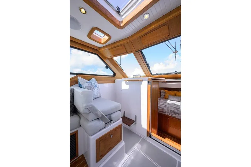 Slide: The Image of Interior of 2022 True North 34 yacht with seating and cabin view. - 58