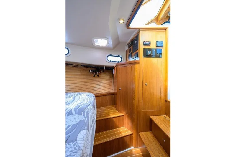 Slide: The Image of Interior of 2022 True North 34 boat with wooden cabinetry and steps. - 75