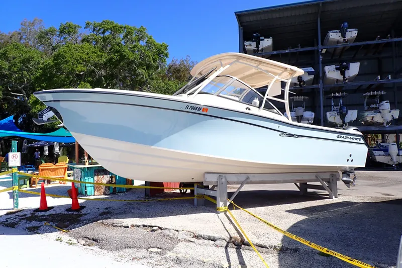 The Image of 2016 Grady-White Freedom 275 boat displayed outdoors on a stand. - 0