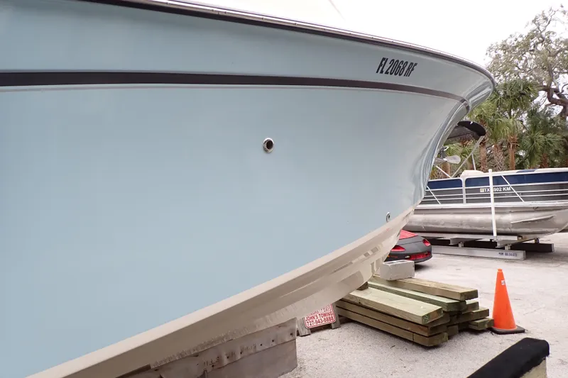 Slide: The Image of 2016 Grady-White Freedom 275 boat on trailer, side view with registration number. - 112