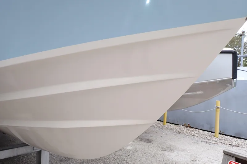 Slide: The Image of 2016 Grady-White Freedom 275 boat hull, close-up view, showcasing sleek design. - 127