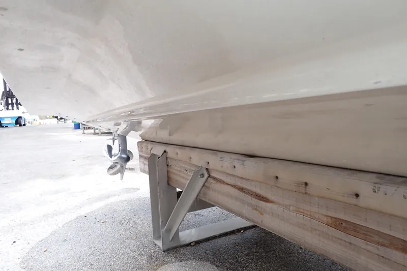 Slide: The Image of 2016 Grady-White Freedom 275 boat hull and propeller on trailer. - 130