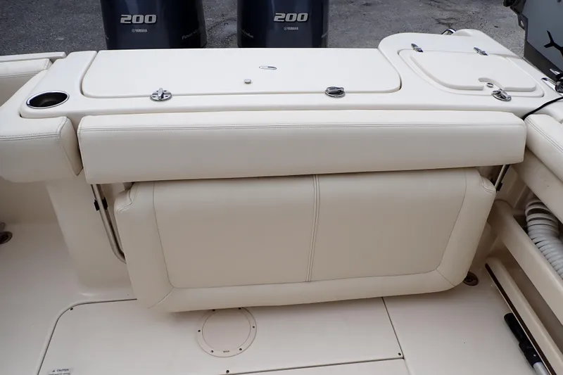 Slide: The Image of 2016 Grady-White Freedom 275 boat interior with Yamaha 200 engines visible. - 18