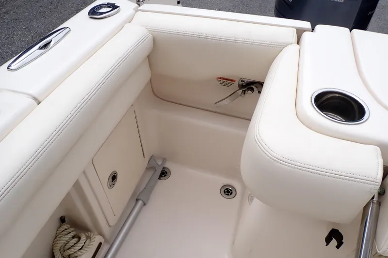 Slide: The Image of 2016 Grady-White Freedom 275 boat interior with seating and cup holder. - 32