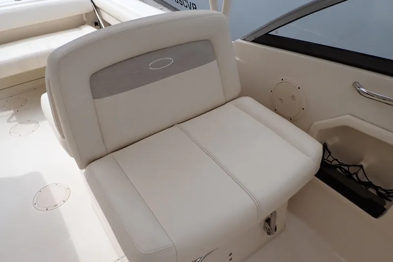 Slide: The Image of 2016 Grady-White Freedom 275 boat interior with beige seating and storage. - 37