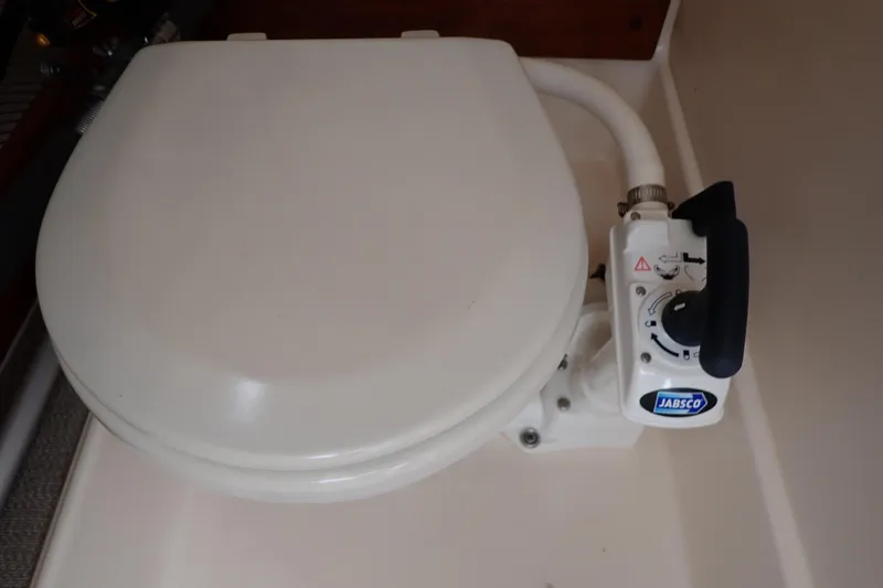 Slide: The Image of Marine toilet in 2016 Grady-White Freedom 275 boat, featuring Jabsco manual pump. - 46