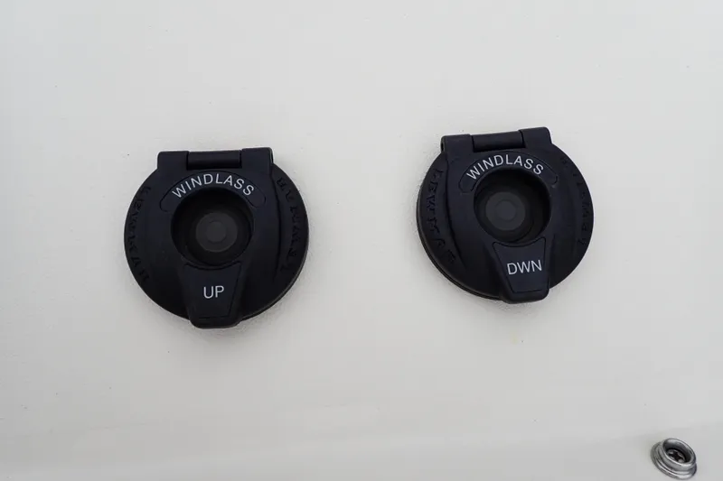 Slide: The Image of Windlass controls on 2016 Grady-White Freedom 275 boat, labeled "UP" and "DWN". - 69
