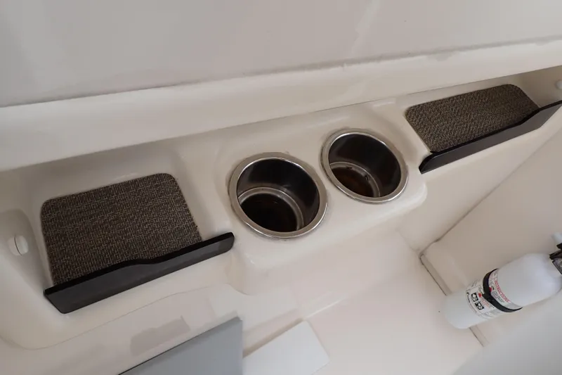 Slide: The Image of 2016 Grady-White Freedom 275 boat interior with cup holders and fire extinguisher. - 75