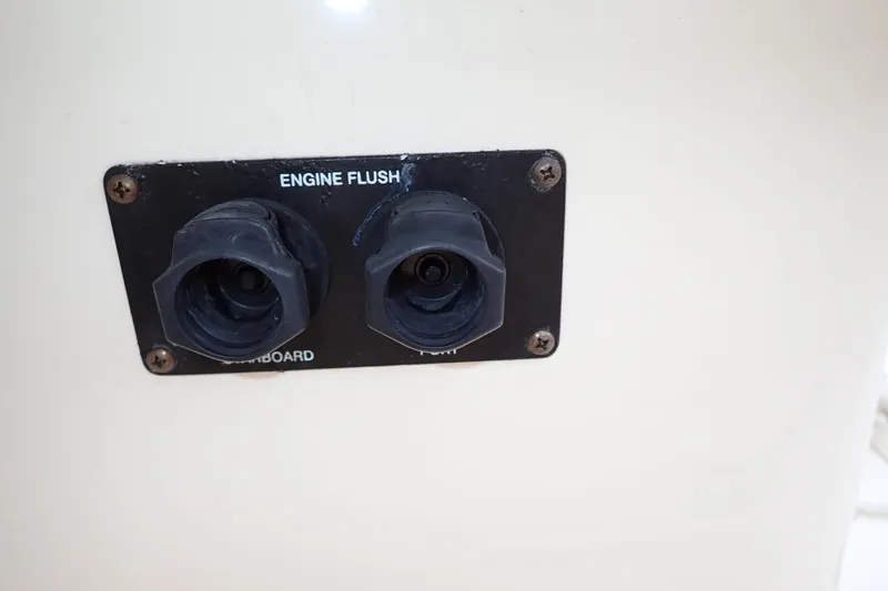 Slide: The Image of Engine flush ports on 2016 Grady-White Freedom 275 boat. - 78