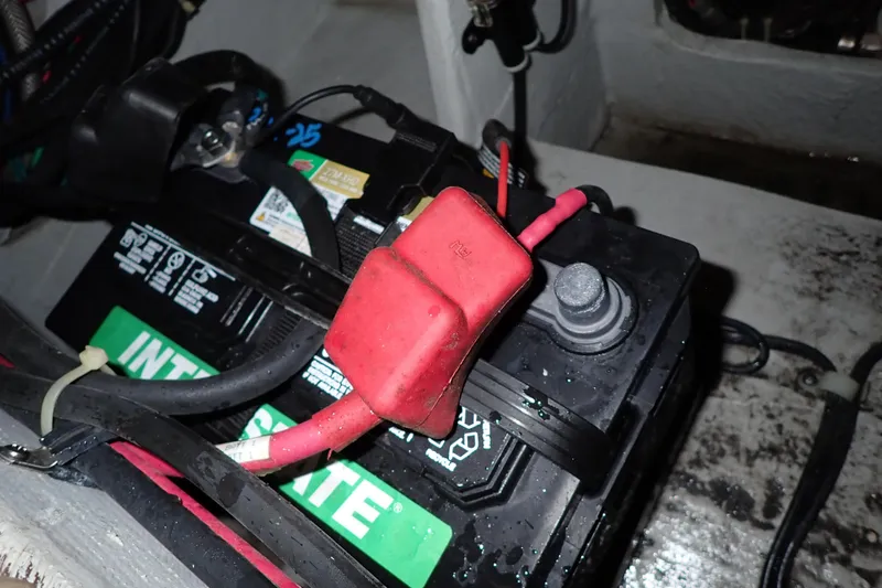 Slide: The Image of Battery compartment of 2016 Grady-White Freedom 275 boat with Interstate battery. - 83