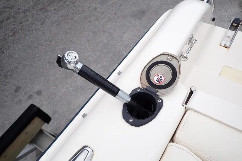 Slide: The Image of Fuel filler cap and nozzle on 2016 Grady-White Freedom 275 boat. - 86