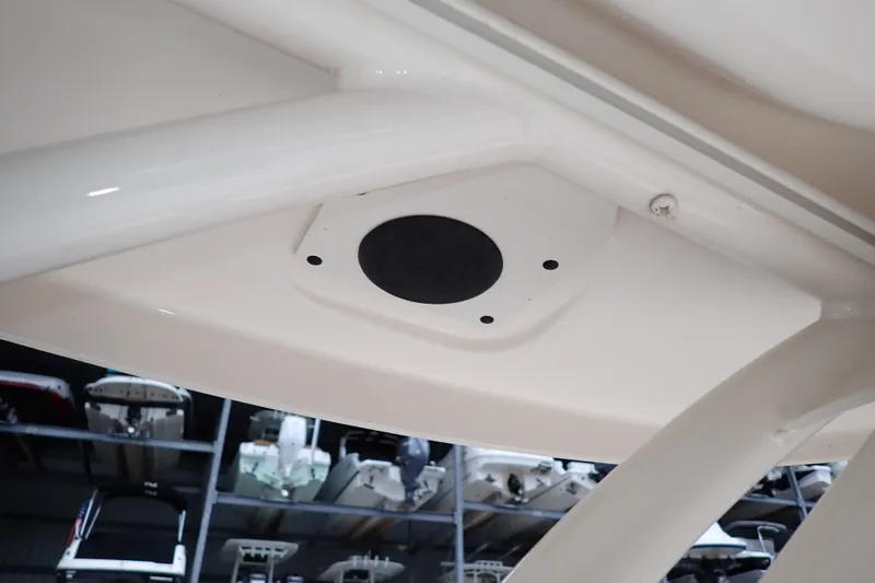 Slide: The Image of 2016 Grady-White Freedom 275 boat interior detail with storage racks in background. - 90