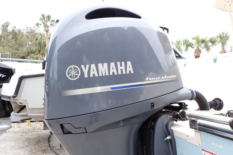 Slide: The Image of Yamaha four-stroke engine on 2016 Grady-White Freedom 275 boat, outdoor setting. - 95