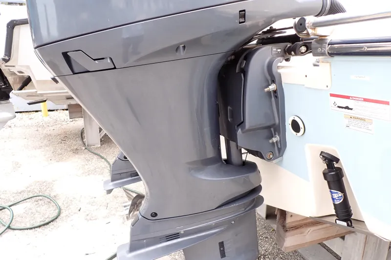 Slide: The Image of 2016 Grady-White Freedom 275 boat engine close-up, showcasing sleek design and details. - 96