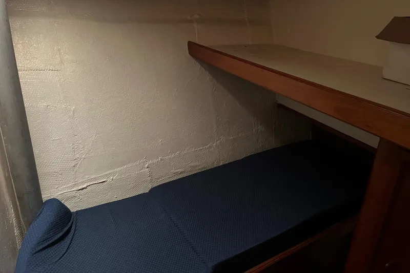 Slide: The Image of Interior cabin of 1989 Egg Harbor 41 Convertible with bunk bed and storage. - 11