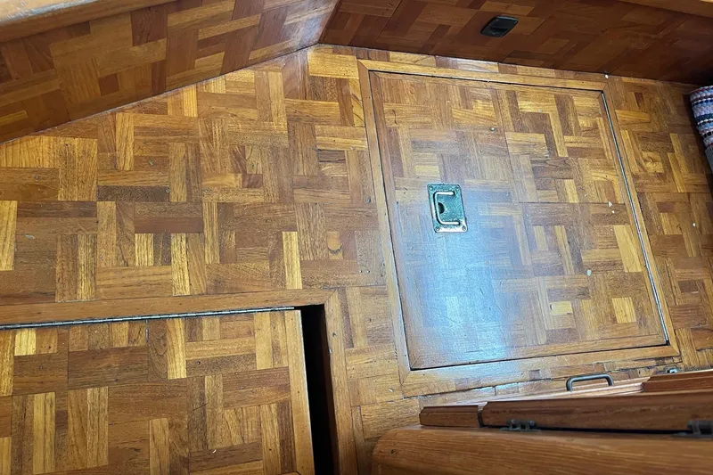 Slide: The Image of Wooden parquet flooring with hatch on 1989 Egg Harbor 41 Convertible boat. - 20
