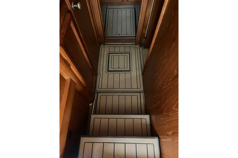 Slide: The Image of Interior stairs of 1989 Egg Harbor 41 Convertible yacht with wooden paneling. - 22