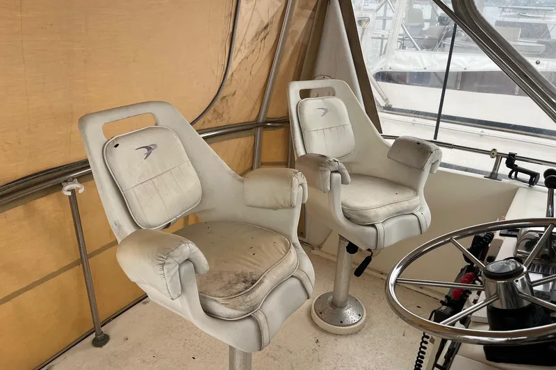 Slide: The Image of Captain's chairs on 1989 Egg Harbor 41 Convertible boat, helm station view. - 5