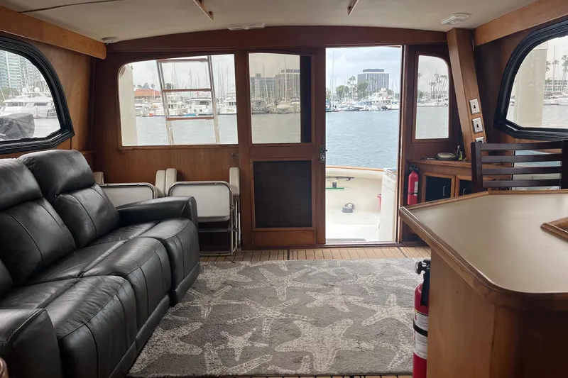 Slide: The Image of Interior of 1989 Egg Harbor 41 Convertible yacht with leather seating and marina view. - 7