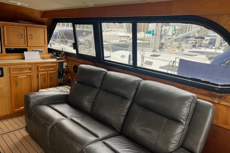 Slide: The Image of Interior of 1989 Egg Harbor 41 Convertible yacht with leather sofa and wooden cabinetry. - 9