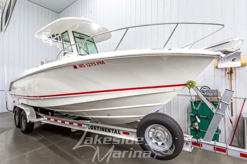 The Image of 2023 Boston Whaler 250 Outrage boat on trailer at Lakeside Marina. - 1