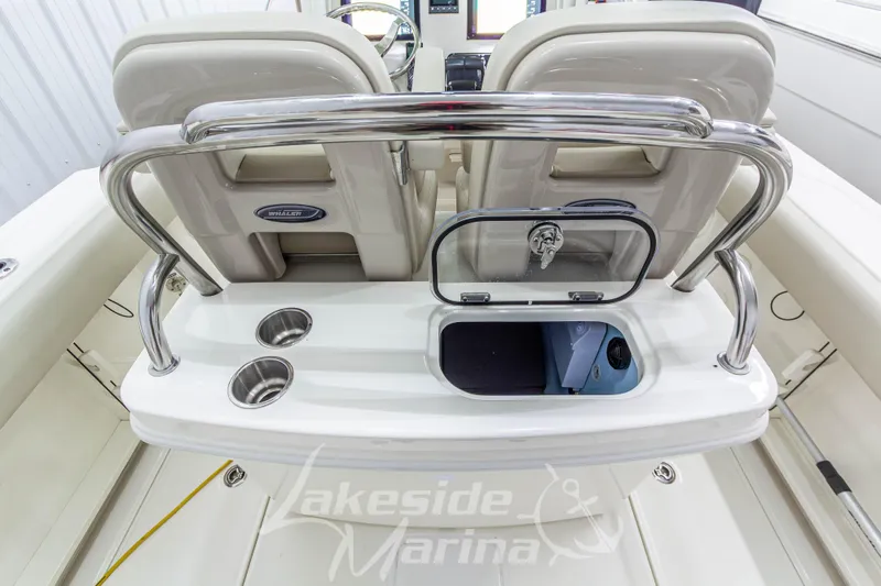 Slide: The Image of 2023 Boston Whaler 250 Outrage boat interior with seating and storage compartments. - 14