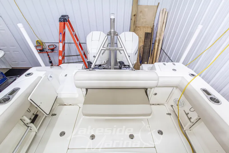 Slide: The Image of 2023 Boston Whaler 250 Outrage boat interior with seating and storage compartments. - 20