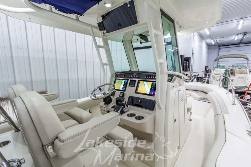 Slide: The Image of 2023 Boston Whaler 250 Outrage boat interior with advanced navigation system and comfortable seating. - 29
