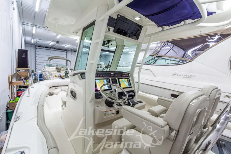 Slide: The Image of 2023 Boston Whaler 250 Outrage boat interior with modern navigation system at Lakeside Marina. - 31